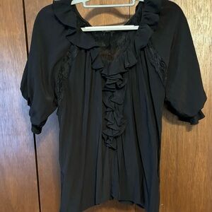 Never worn but has been washed black top with ruffles